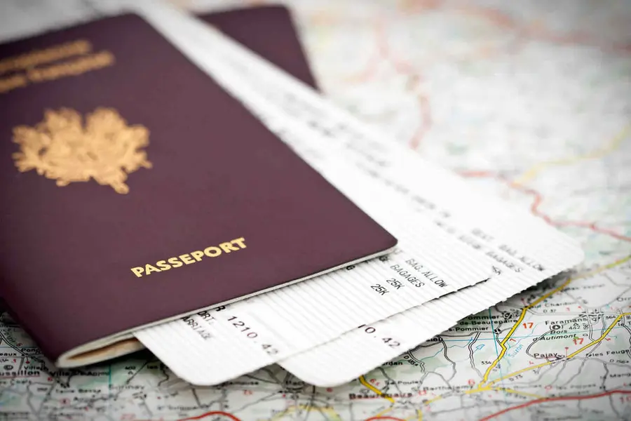Passport and travel documents on a map